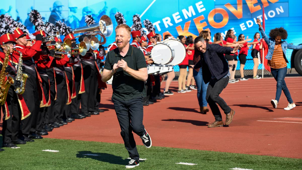 Extreme Makeover: Home Edition host in front of a trumpet band Extreme Makeover: Home Edition host in front of a trumpet band