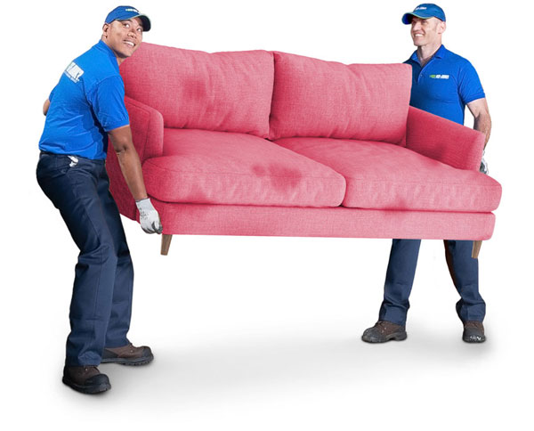 Two 1-800-GOT-JUNK? team members carrying a red sofa Two 1-800-GOT-JUNK? team members carrying a red sofa